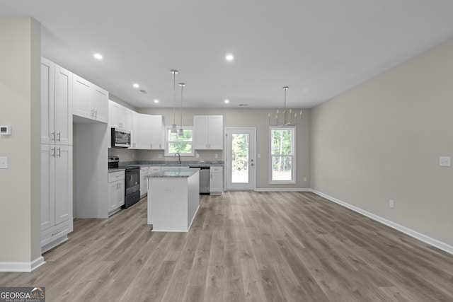 unfurnished room featuring concrete flooring