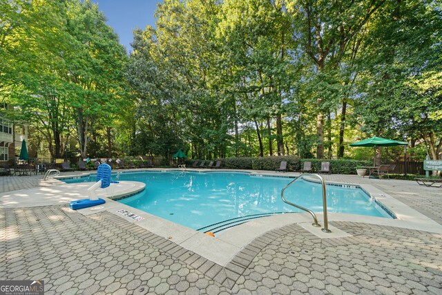 view of pool with a patio