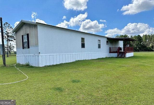 view of home's exterior with a yard