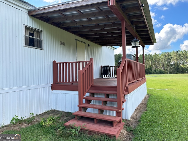 wooden deck with a yard