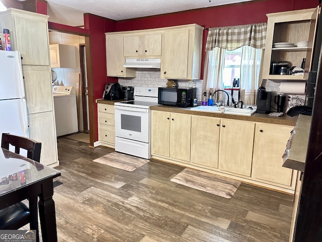 kitchen featuring tasteful backsplash, dark hardwood / wood-style floors, a textured ceiling, washer / clothes dryer, and white appliances