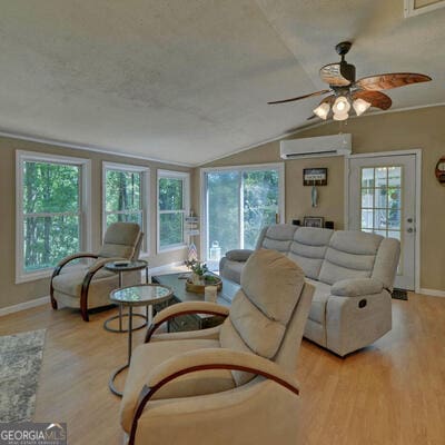 carpeted bedroom featuring a textured ceiling, access to exterior, and multiple windows