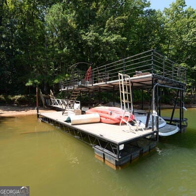 dock area with a water view