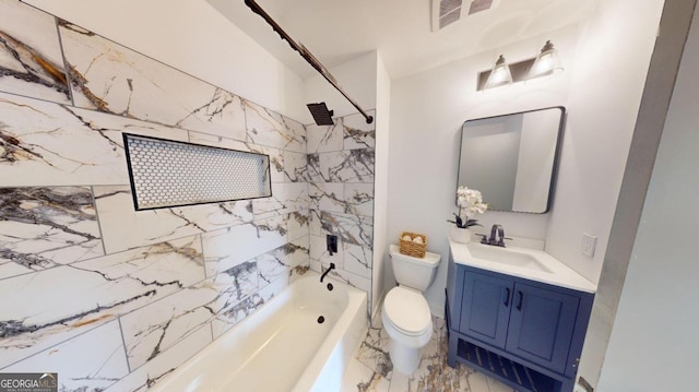 full bathroom with tiled shower / bath, vanity, toilet, and tile patterned flooring