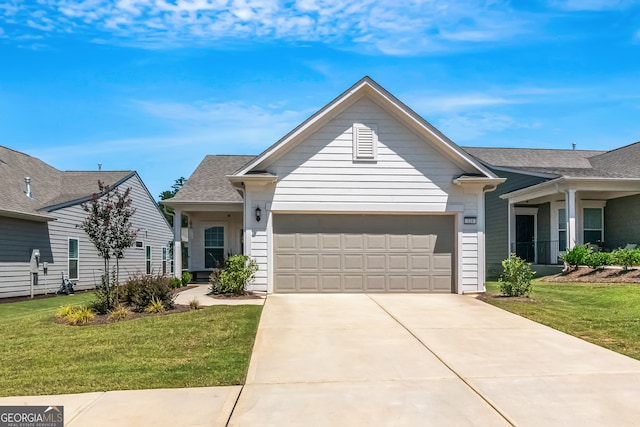 view of front of home featuring a garage and a front lawn