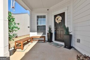 property entrance featuring covered porch