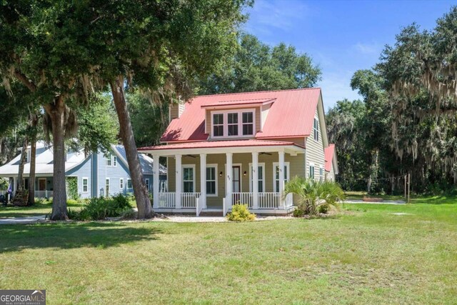 view of front of house featuring a front yard and covered porch