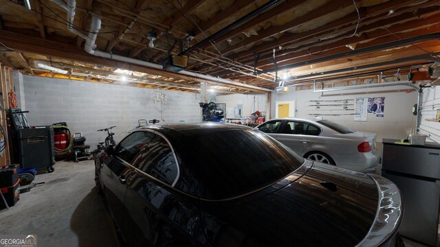 garage featuring stainless steel refrigerator