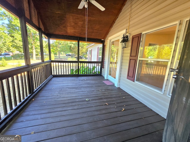 wooden terrace with ceiling fan and a porch