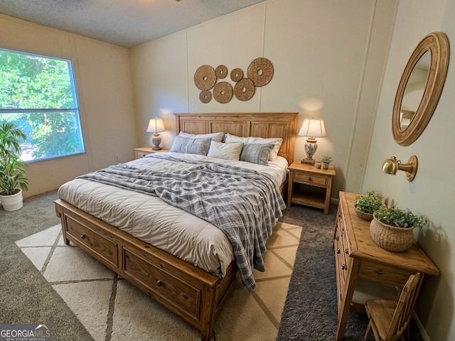 carpeted bedroom featuring a textured ceiling