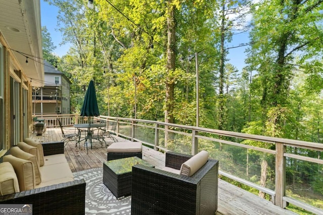 wooden deck featuring outdoor lounge area