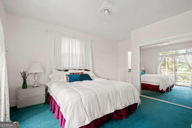 bedroom featuring a closet and carpet floors