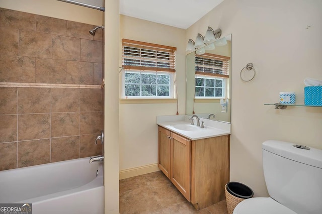 bathroom featuring shower / bath combination, baseboards, toilet, tile patterned flooring, and vanity