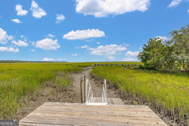 view of dock featuring a rural view