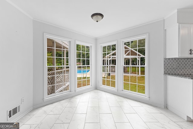 unfurnished sunroom featuring visible vents