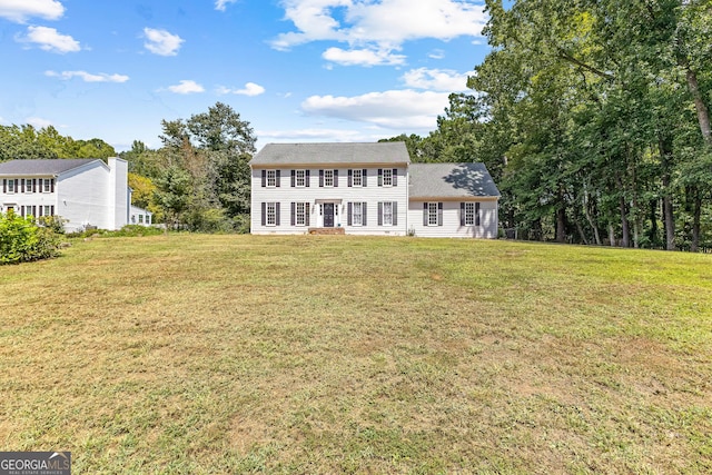 back of house with a yard