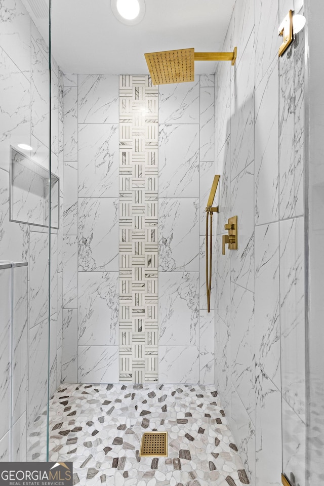 bathroom featuring a shower stall