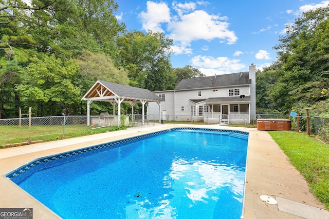 view of pool featuring a hot tub, a fenced in pool, fence private yard, a gazebo, and a patio area