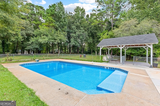 view of swimming pool featuring a gazebo, a fenced backyard, and a fenced in pool