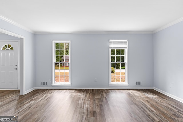 interior space with dark wood-style floors, ornamental molding, and visible vents