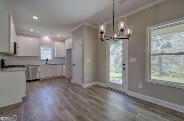 kitchen featuring decorative light fixtures, appliances with stainless steel finishes, dark wood-type flooring, and decorative backsplash