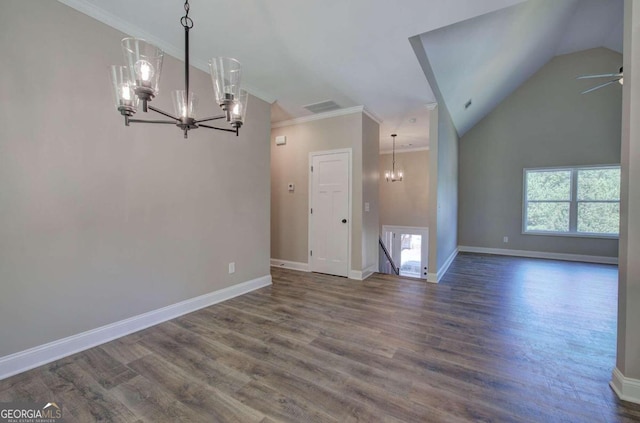 unfurnished living room with an inviting chandelier, dark hardwood / wood-style flooring, and crown molding