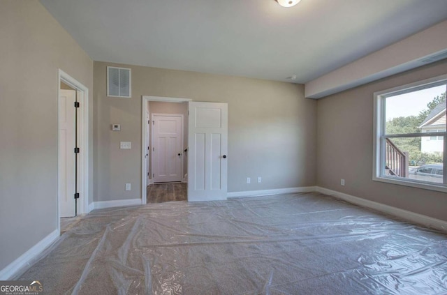 unfurnished bedroom featuring light colored carpet