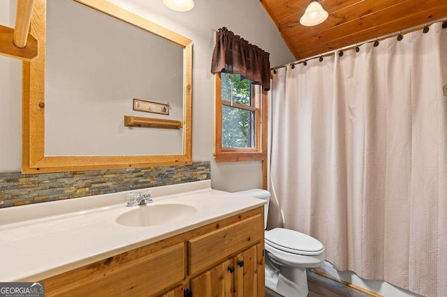 bathroom featuring a shower with shower curtain, vaulted ceiling, toilet, decorative backsplash, and vanity