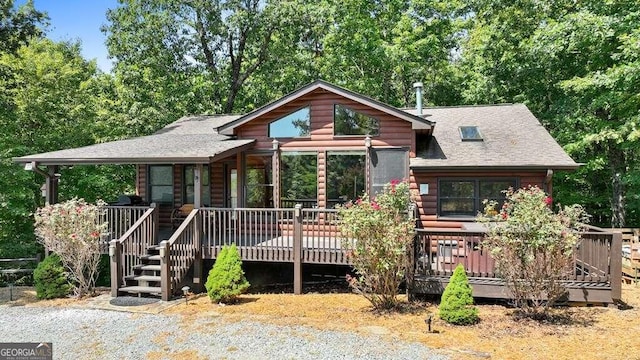 log cabin with a deck