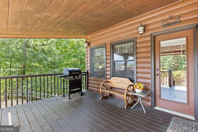 wooden deck featuring grilling area