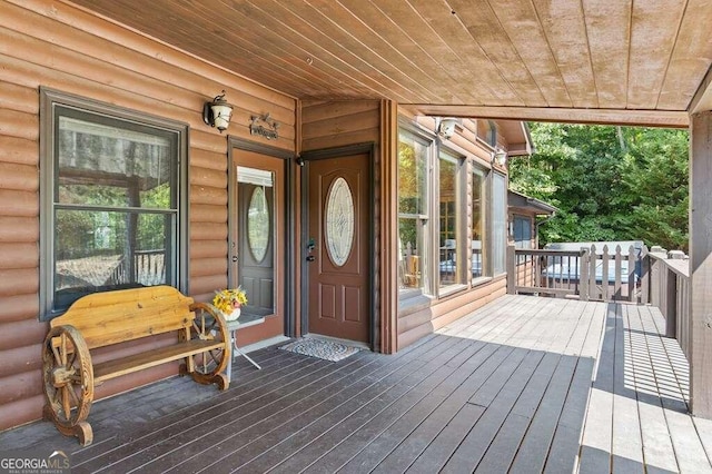 doorway to property with a wooden deck