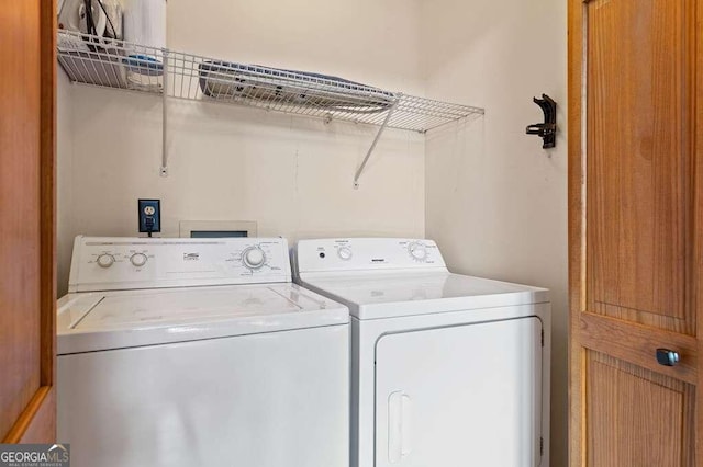 laundry area with washing machine and dryer