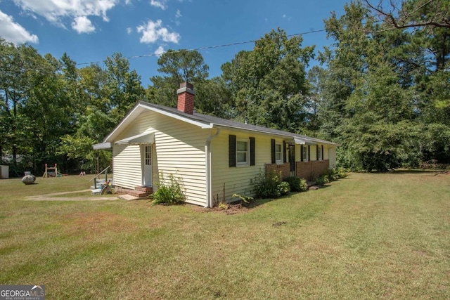 view of property exterior featuring a lawn