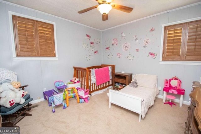 bedroom featuring a textured ceiling, crown molding, ceiling fan, and carpet floors