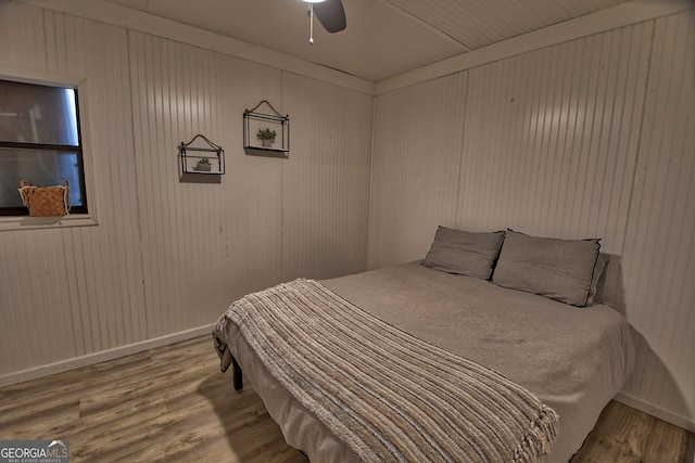 bedroom featuring hardwood / wood-style flooring and ceiling fan