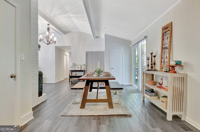 dining area with crown molding, lofted ceiling with beams, a notable chandelier, and wood-type flooring