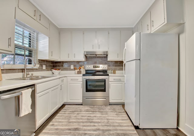 kitchen featuring light hardwood / wood-style flooring, stainless steel appliances, sink, and white cabinets