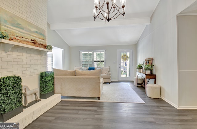 living room with dark wood-type flooring, vaulted ceiling with beams, and an inviting chandelier