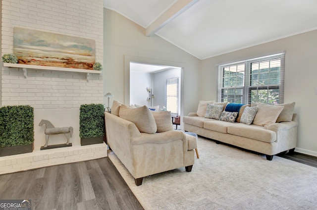 living room featuring ornamental molding, hardwood / wood-style flooring, and lofted ceiling with beams