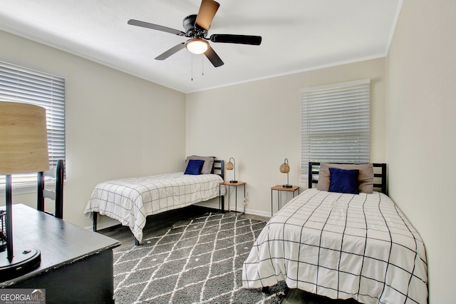 bedroom featuring ornamental molding and ceiling fan