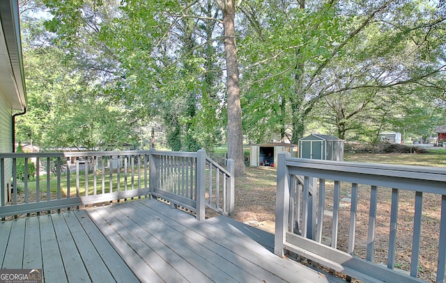 wooden terrace featuring a shed