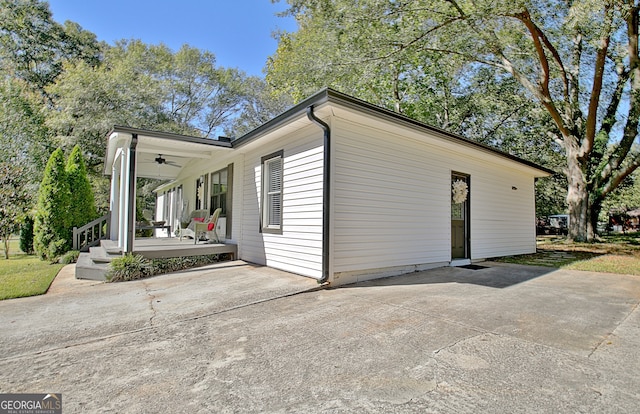 view of property exterior with covered porch