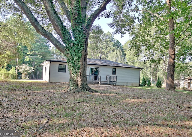 rear view of house with a deck