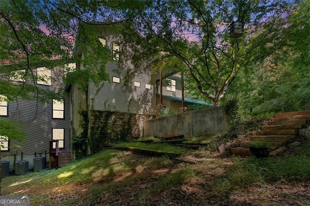 property exterior at dusk with central AC