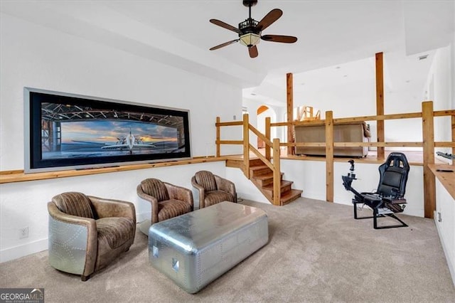 living area with ceiling fan and carpet floors