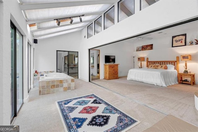 bedroom with high vaulted ceiling and carpet flooring