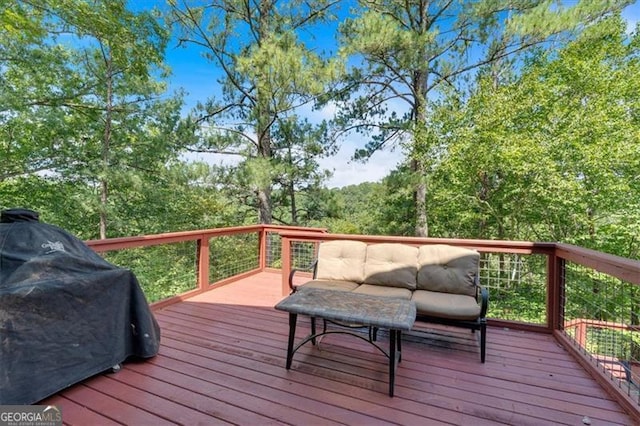 wooden terrace with a grill