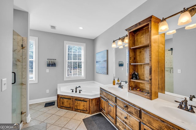 bathroom featuring vanity, independent shower and bath, and tile patterned flooring