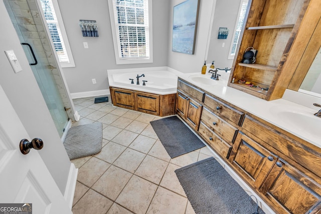 bathroom featuring vanity, shower with separate bathtub, and tile patterned floors