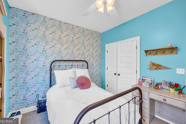 bedroom featuring a closet, ceiling fan, and carpet flooring